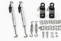 Two polished TorkLift Original FastGun turnbuckles beside the Basic SpringLoad kit with two black canisters, forged turnbuckles, chains and mounting hardware on a light background.