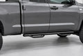 Black tubular cab-length running board beneath a graphite pickup, ending before the bed.